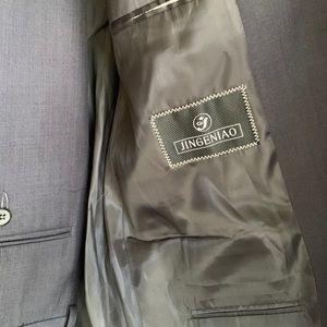 Charcoal gray suit.  Pleated trousers size 34x30.